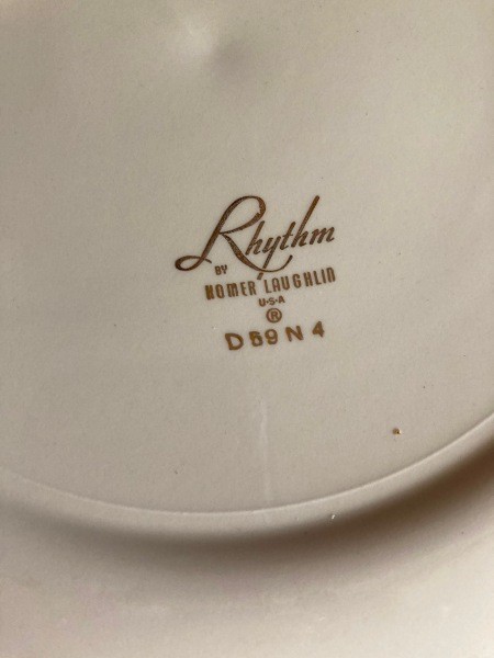 The manufacturer's information on the underside of a china plate.