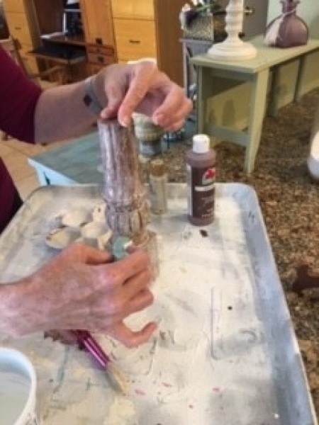 Adding a lighter paint to the chair legs.