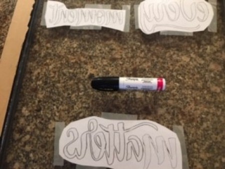 The reverse lettering and a pen.