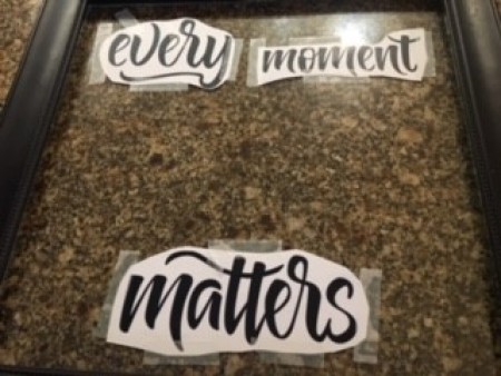 Placing the letters on the underside of the glass.