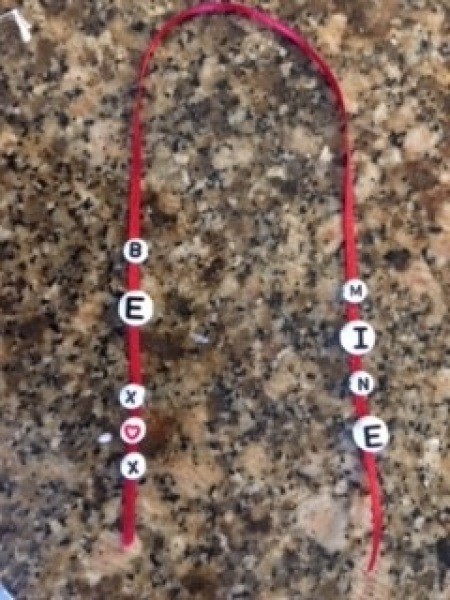 Decorative letters on a ribbon.