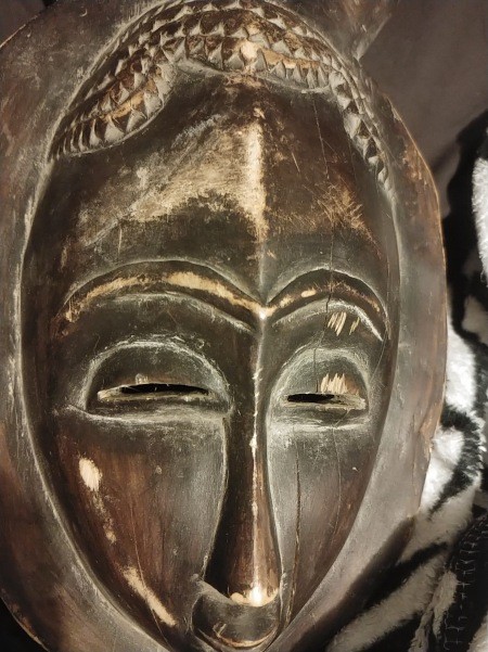 A carved wooden mask.