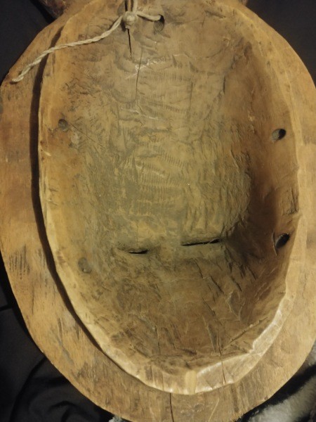 the underside of a carved wooden mask.
