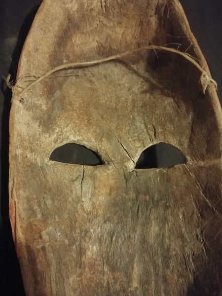 The underside of a carved wooden mask.