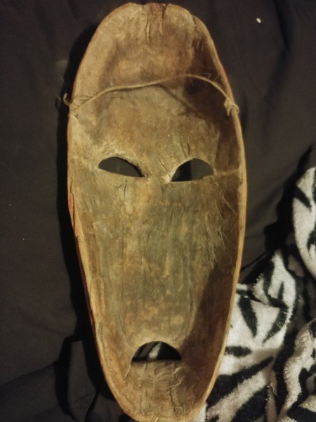 The underside of a carved wooden mask.