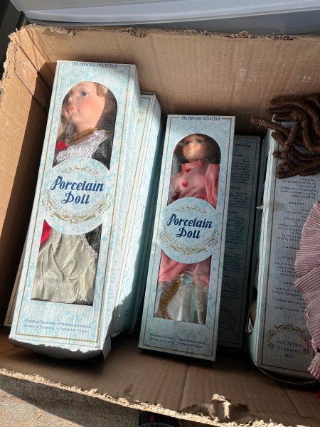 Collectible dolls in their original boxes.