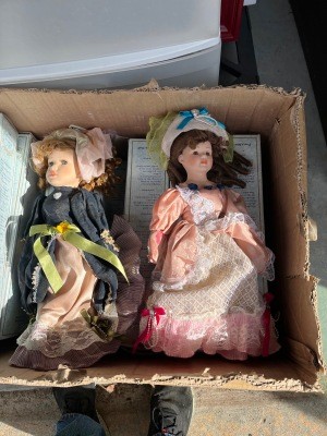 Old dolls in a box.