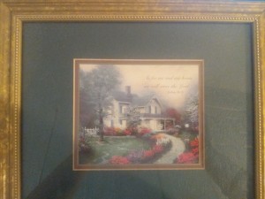 A Thomas Kinkade framed print of a White House and gardens.