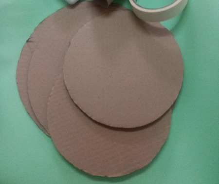 Circles of cardboard as the cake base.