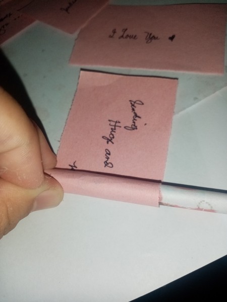 Rolling the notes onto the arrows.