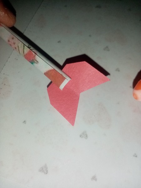 Adding paper to the ends of the arrows.