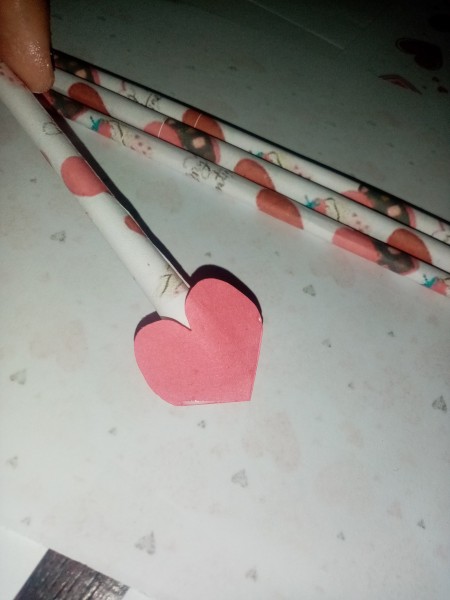 Adding the hearts to the end of an arrow as the point.