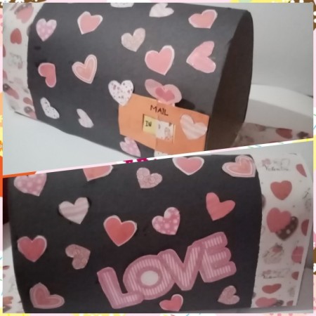 Adding decorative paper to the outside of the mailbox.