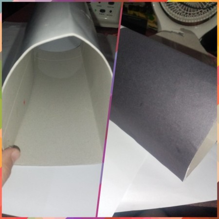 Bending paper into a mailbox shape.
