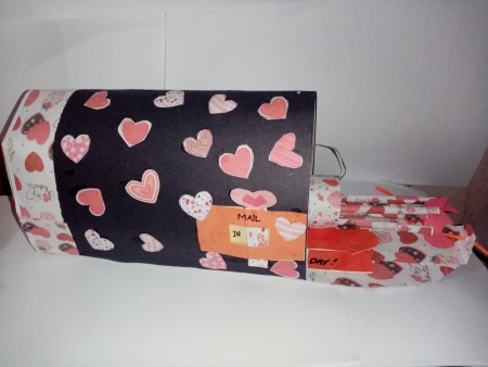 Adding valentine notes to the mailbox.