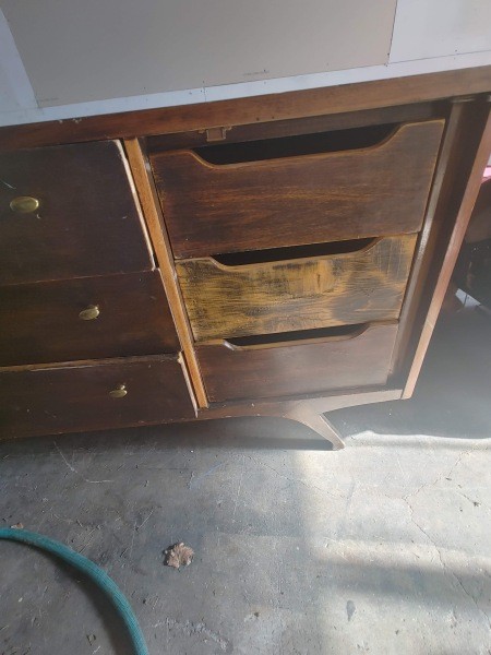 The wooden dresser drawers.