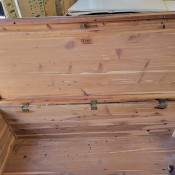 A cedar chest with the lid opened.
