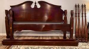 A wooden headboard and frame.