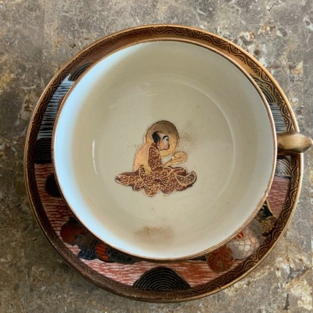 The painted inside of a teacup.