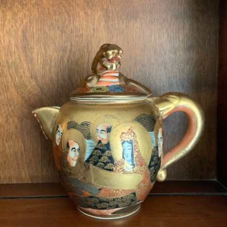 A decorative creamer.