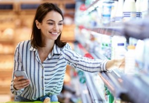 A woman shopping at a grocery store.