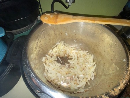 Sautéing onions in the pot.