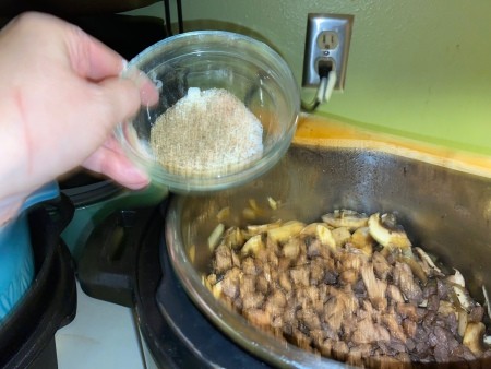 Adding flour to the mixture.