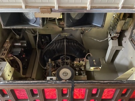 Looking inside a jukebox.
