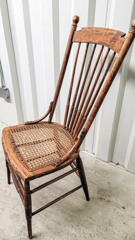 Side view of old wooden chair.