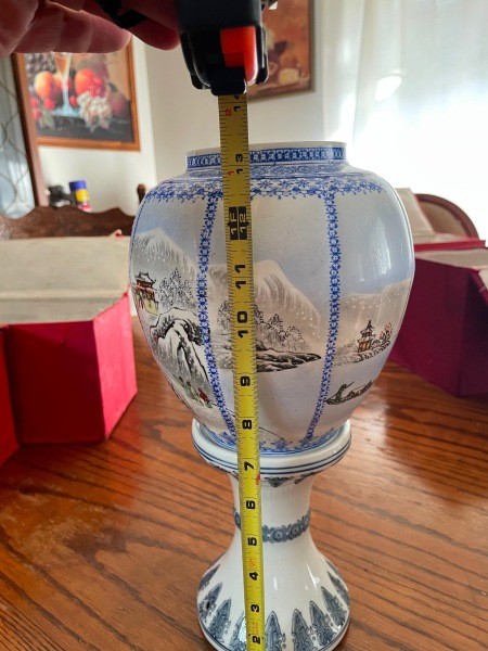 Measuring an antique vase.