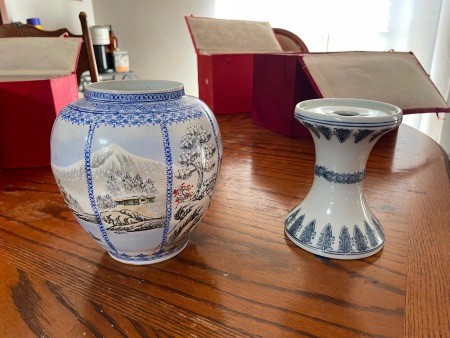 An antique vase with a stand.