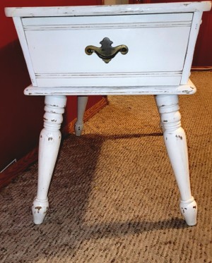 A Mersman side table painted white.