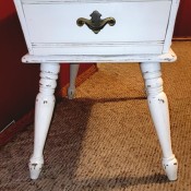 A Mersman side table painted white.