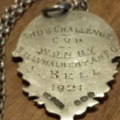 A silver football medal from 1921