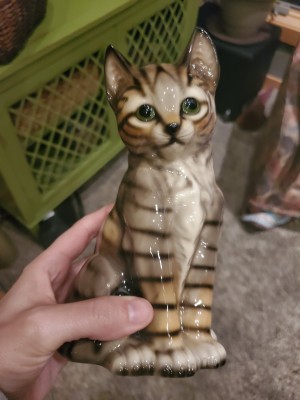 A ceramic cat figurine.