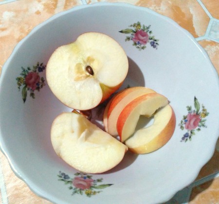 A bowl of cut apples.
