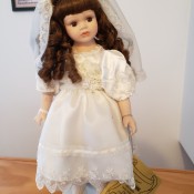 A doll in a white dress and veil.