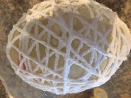 Allowing the yarn egg to dry.