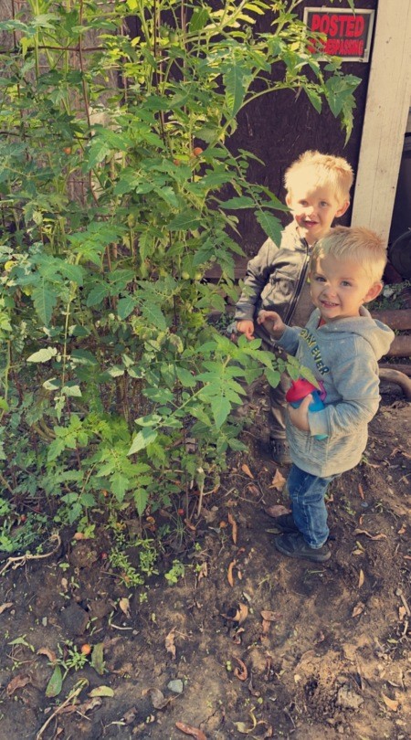 Two young kids in the garden.