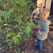 Two young kids in the garden.