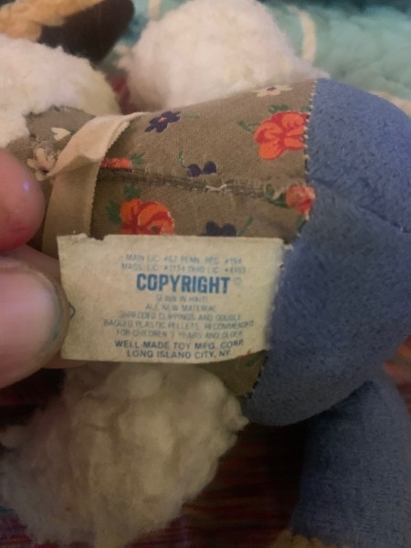 The tag on a plush lamb.