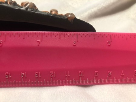 Measuring the figurine.