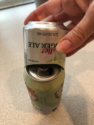 Placing the cut can over the full can.