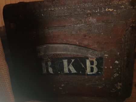 Initials on the side of a trunk.
