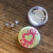 Buttons next to silicone earring backs.
