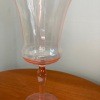 A pink goblet style glass.