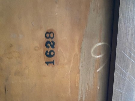 A number inside a wooden desk.