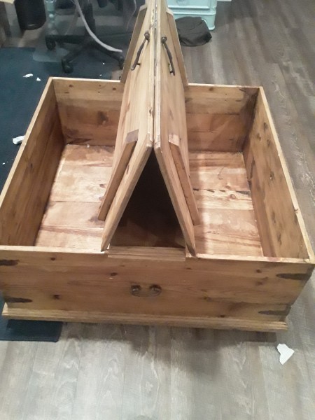 Opening a coffee table chest.