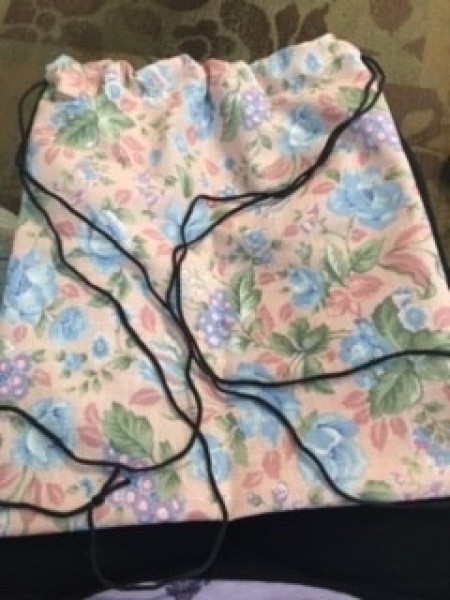 Adding the straps to the backpack.