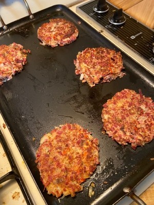 Cooking hash on a griddle.